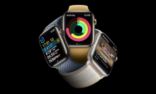 Three apple watch 8s on a black background